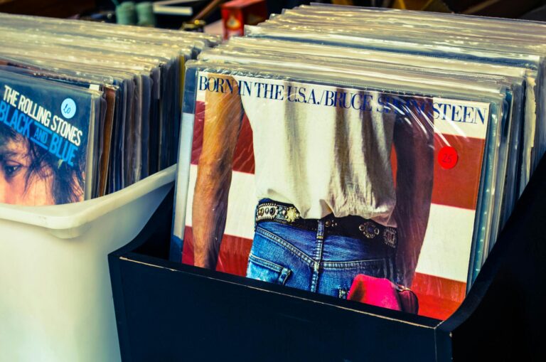 Collection of classic vinyl records including Bruce Springsteen and Rolling Stones.